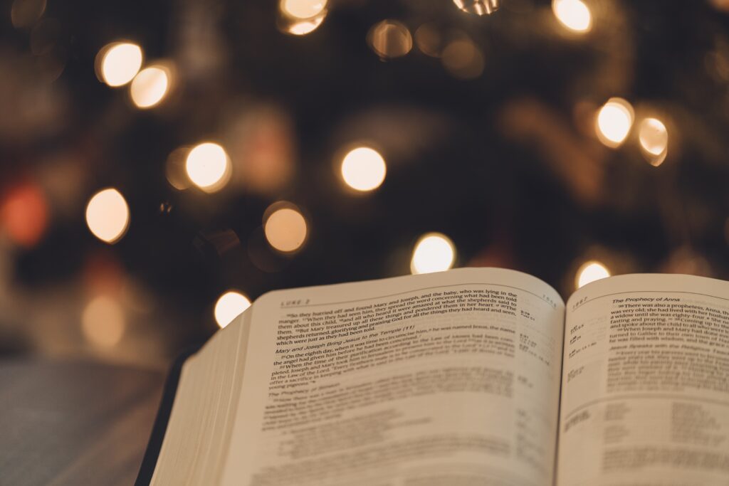 backlight Christmas tree with Bible open to Luke 2